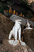 Luang Prabang, Laos - The Pak Ou Caves, the lower cave called Tham Ting. The caves, a Buddhist pilgrimage site, are a repository of old Buddha statues. 